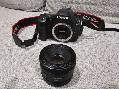 Camera is in excellent condition, everything works fine, comes with 50mm lens and lens cap, 2 batter...