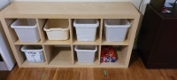 Ikea Kallax shelf unit with storage bins.