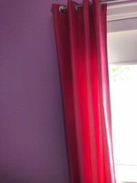 Dark pink curtain panels. 