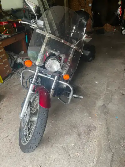 Beautiful bike to short for my husband . Would be a great life bike. Red in Color. Windshield, 2 sad...