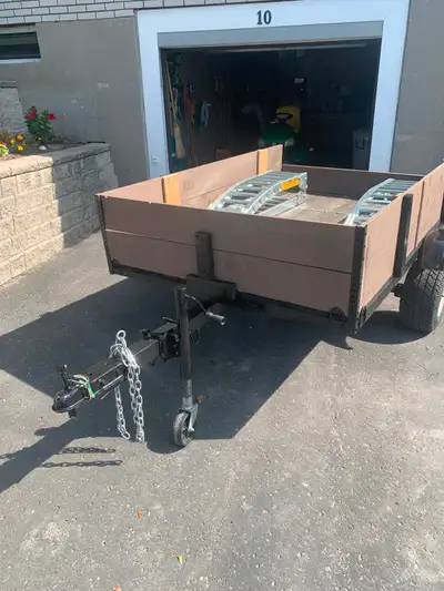 54x80 inch box. New lights, safety chains and loading ramps. Tows great. Ready to use.