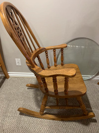 Solid mid century wooden rocking chair