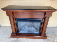 Beautiful wooden electric fireplace with black marble top