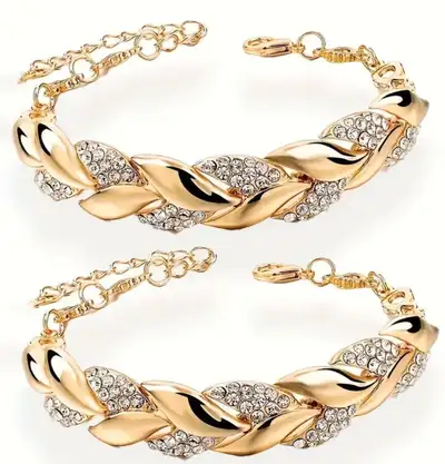 Elevate your style with this eye-catching gold leaf and crystal bracelet, a stunning piece that adds...