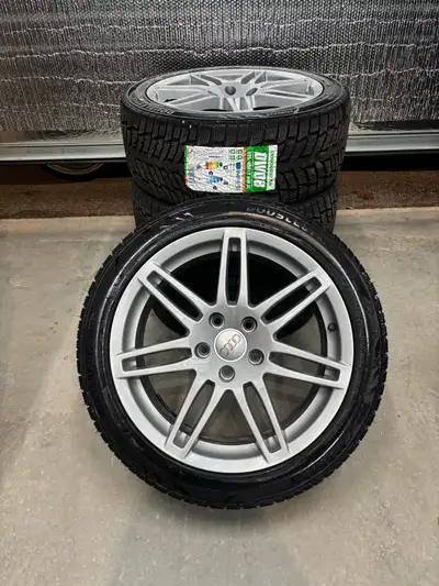Selling a set of Audi style rims with new winter tires. 5x112 bolt pattern 66.6 hub bore 17x7.5 38 o...