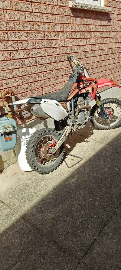 The Honda 150 is a used dirt bike perfect for off-road adventures. It's in fair condition. Ready to...