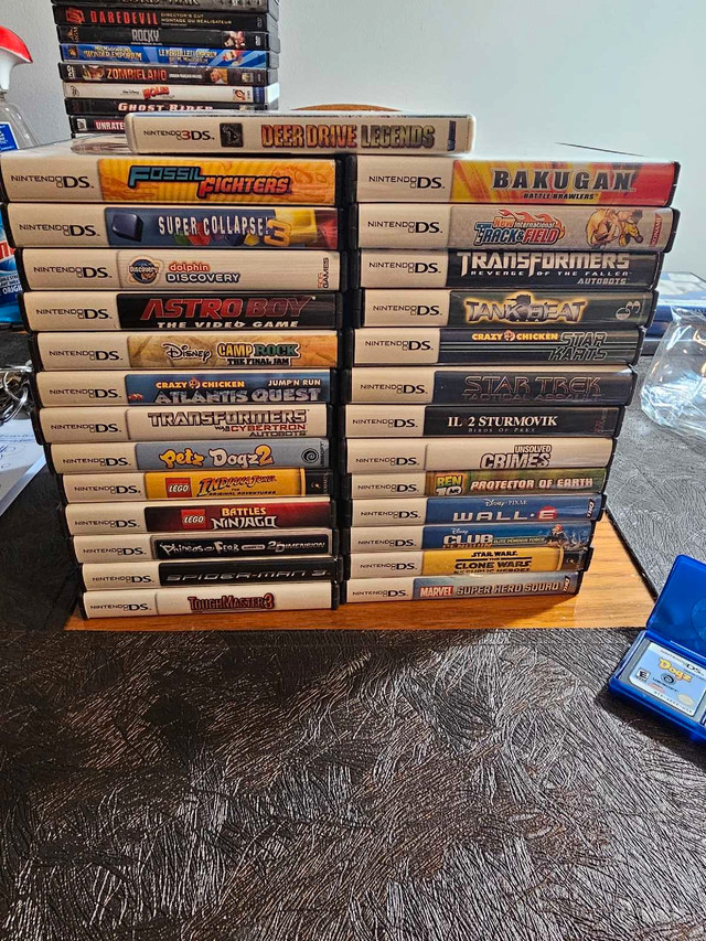 Nintendo DSI + 33 Games  in Nintendo DS in St. Catharines
