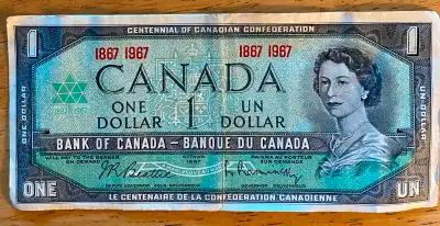 Billet de 1 $ canadien émis en 1967 pour le Centenaire de la Confédération canadienne. Quelques trac...