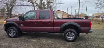F350 Lariat 6.7 diesel 150,000 KLM on new engine extra fuel tank and toolbox combo truck runs great...