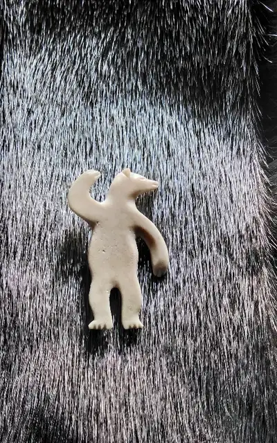 Ivory Dancing polar bear pendant and hand-crafted kamik earring, View more