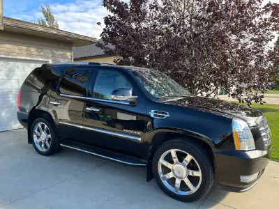 Selling my 2014 Cadillac Escalade Luxury. This SUV is fully loaded, black on black, all-wheel drive,...