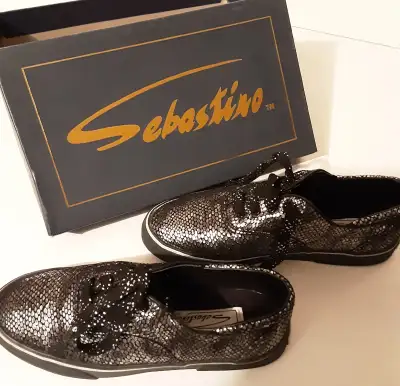 Leather uppers on grippy full rubber soles. Original laces, in box, ready to wear. Bought them as my...