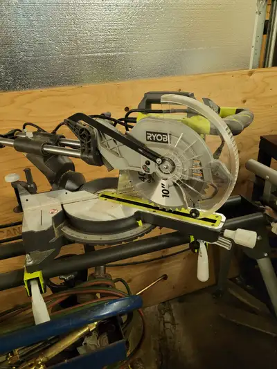 Ryobi 10" compound miter saw with adjustable cutting table, View more