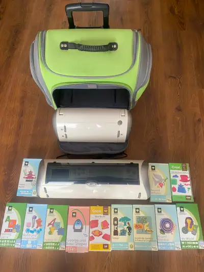 1 Cricut Expression and 1 Cricut original with case. Includes 12 cartridges.