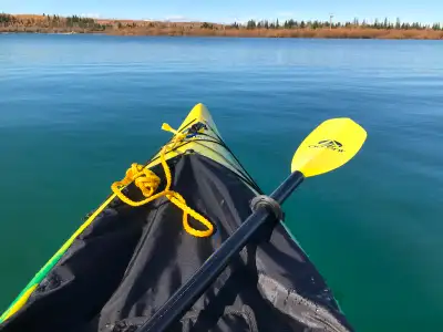 Like-new Iqualiut kayak, a stable recreational kayak with a large cockpit opening. Has a padded seat...