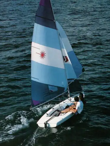 Laser 2 sailboat. Firm deck and hull. Sail in good condition. Complete kit with trapeze rigging and...