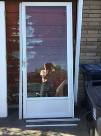 Aluminum Storm Door with adjustable height.