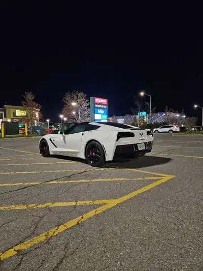 I'm selling my White 2014 Chevrolet Corvette with a red interior and 7 speed manual transmission. It...