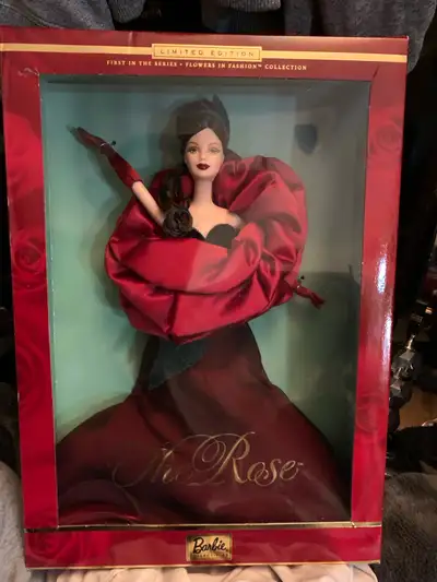 This is a limited edition The Rose Barbie doll, still in its original box. The doll is part of the F...