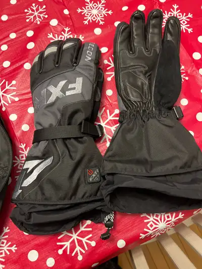 Brand new fxr heated gloves comes with charger and batteries text me 780-679-8677 located in red dee...