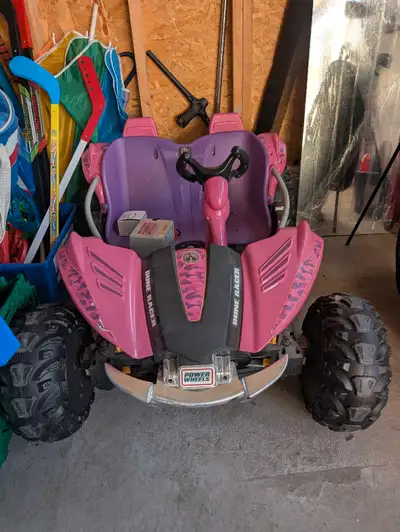 Pink/ Purple 12V PowerWheels Dune racer in very good condition. Comes with battery and charger.