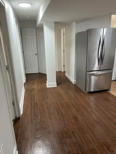 This spacious unit is available for rent, featuring a modern kitchen with stainless steel appliances...