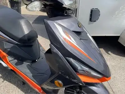 Well maintained by JJ Scooters Minor scratches due to low speed side ly Comes with new back carrier
