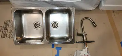 Double basin, stainless steel, drop-in kitchen sink. 29.5"L x 18"W x 7"D. Fits a 36" cabinet. With b...