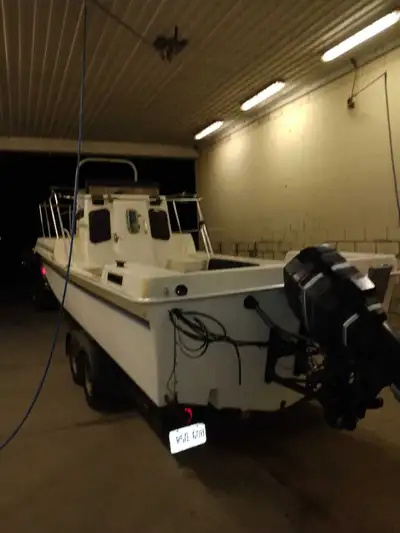 Fiberglass trawler fishing boat has a inside area with the toilet has two couches with live walls un...