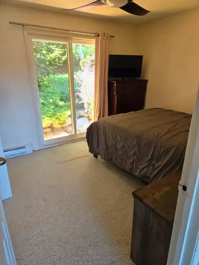 Available July 1st. Furnished room with closet and sliding door to backyard contains a queen sized b...