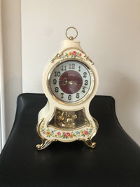 Vintage Rhythm quartz alarm mantle clock with 3 melodies.12”.