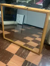 A 3 mirrored door bathroom cabinet