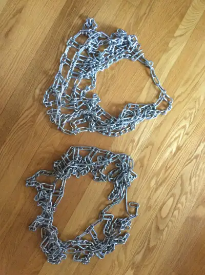 Never used rear wheel traction chains for L111 John Deere tractor. Tire size 20x 8.0 - 8 NHS