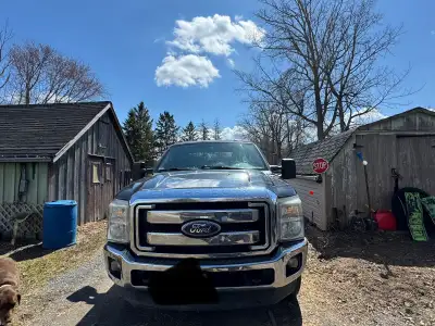 Selling a 2011 F350 Super Duty Crew cab body Cloth interior Mileage on the truck is 412612 Gas. 6 se...