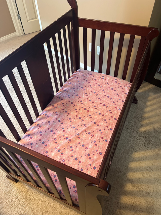 Crib with mattress and sheets. in Cribs in Edmonton - Image 3