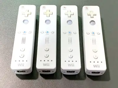 $80 firm Lot of 4 - OEM Nintendo Wii Remote Controllers All working great, in used good condition