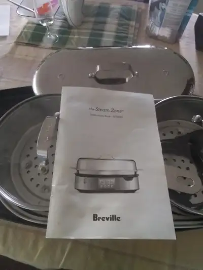 Breville "Steam Zone" duel cooker. Two heat zones. Multiple foods (2 at a time) can be cooked to per...