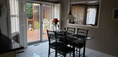 Glass kitchen table on wrought iron base with 4 chairs, View more