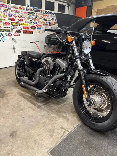2011 sportster 48 that has only 2000 miles on it very nice bike