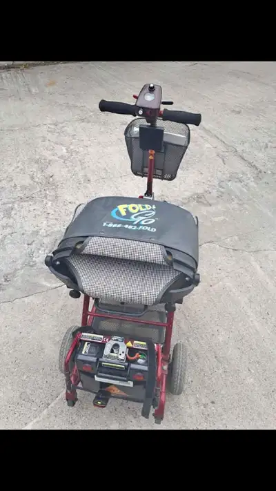 Scooter folds up to transport in vehicle lightweight newer battery comes with charger everything wor...