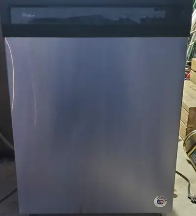 WHIRLPOOL STAINLESS STEEL 24" DISHWASHER clean and working condition Has a small dent as 3rd picture...