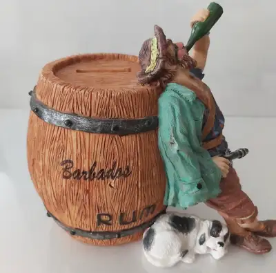 Pirate Rum Barrel Piggy Bank • Material: Hand-painted resin • Design: Pirate, dog, and Barbados rum...