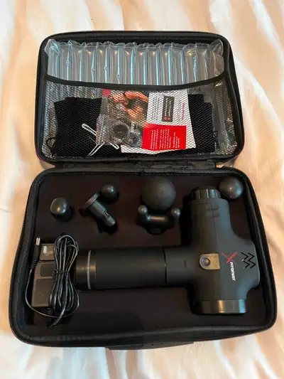 Fitonway massage gun with multiple heads and carrying case. Pretty much brand new. Only used a few t...