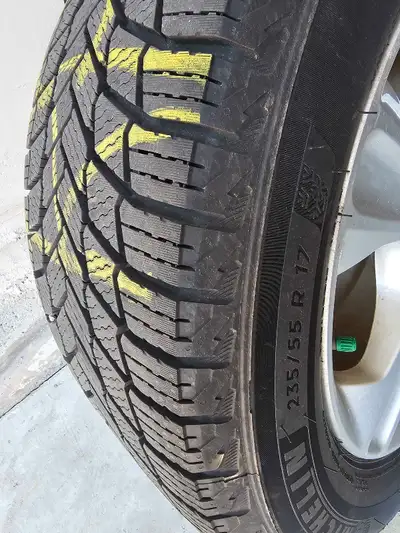 Set of 4 Original Ford Rims in excellent condition with winter tires like new. 3500 kilometers of we...