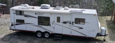 High quality made by Travelaire in Red Deer 30' travel trailer. Front queen bed with under mattress...