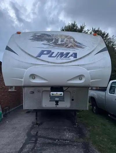 2009 Puma 5th wheel trailer. 27 feet with 2 slide outs. Includes 5th hitch for truck. Trailer featur...