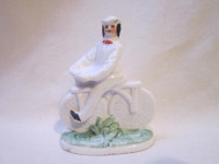 Small Ceramic Man Riding a Bicycle Figurine