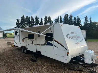 2012 Surveyor SV305 travel trailer by Forest River for sale. Queen bed in front Large sectional couc...