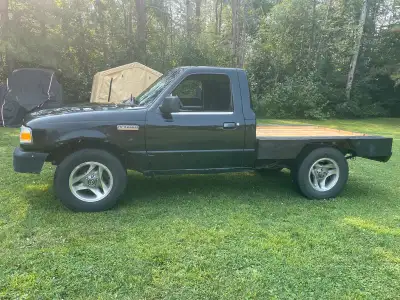 2007 ford ranger base model 2WD automatic, 2.3L 4 cylinder. Flat bed with working break, signal and...