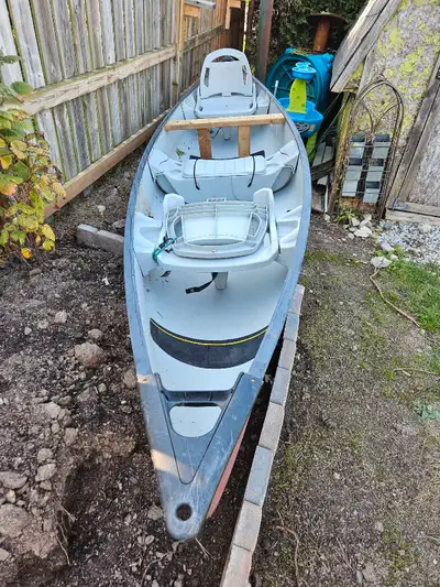 14 1/2 foot canoe with "cooler" Slightly worn canoe, never tested but I was told it floats fine, has...